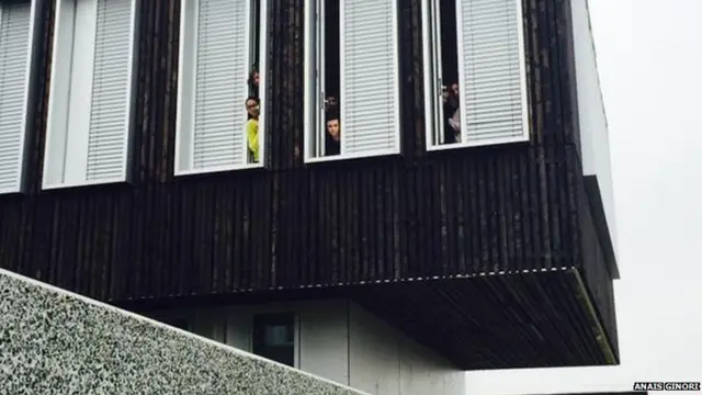 High School Students watching out of windows