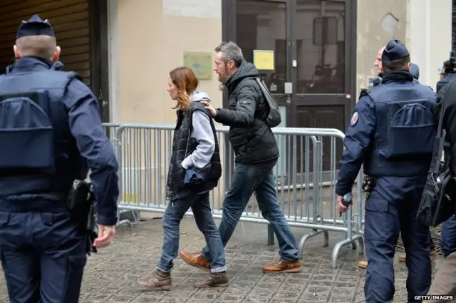 The remaining editorial staff of Charlie Hebdo arrive for a meeting with the remaining editorial staff of Charlie Hebdo at the Liberation offices on January 9, 2015