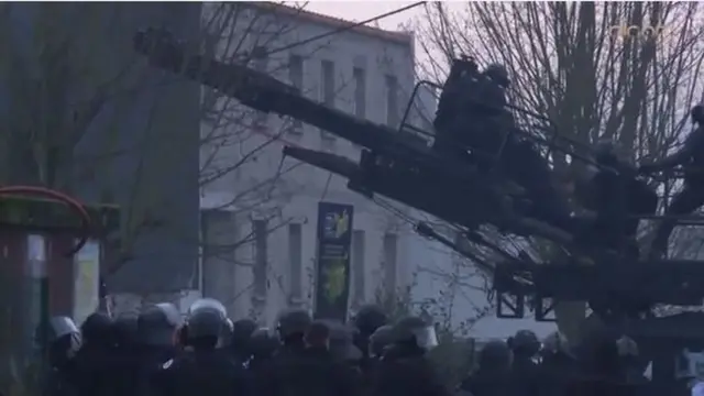 Screen grab of French police outside print works near Paris on 9 January 2015