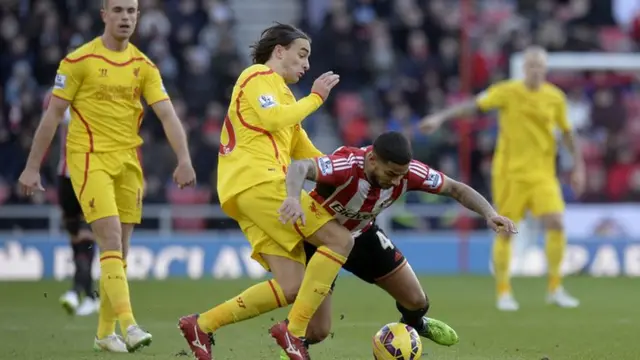 Lazar Markovic challenging for the ball