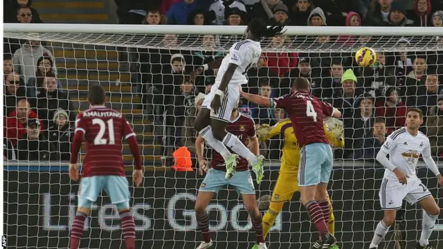 Gomis scores a header