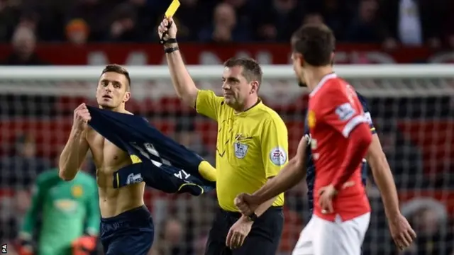 Dusan Tadic is booked for celebrating