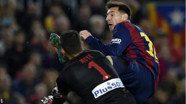 Lionel Messi clashes with Atletico keeper Miguel Angel Moya