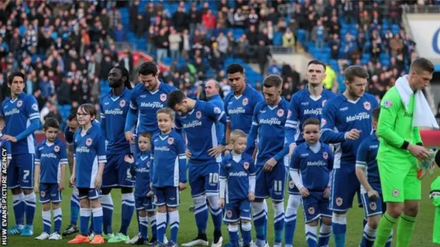 The Cardiff City players lined up in blue at home for the first time since 2012