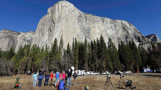 Spectators watch climbers on El Capitan