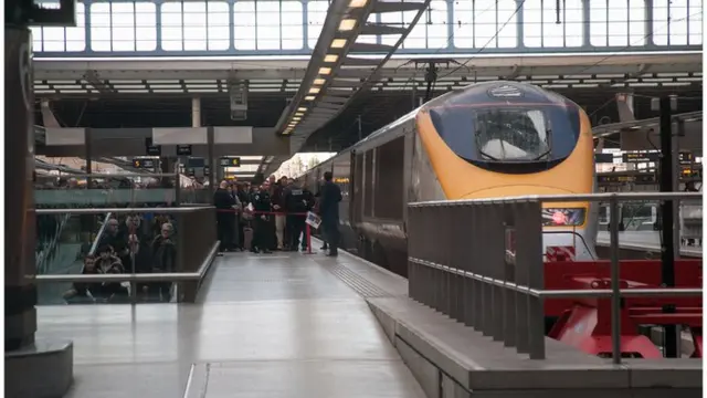 Passengers and police at London St Pancras International