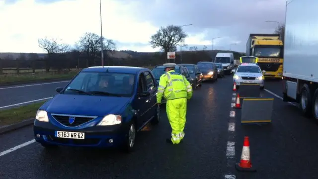 motorists queuing on the approach road to the tunnel