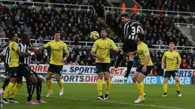 Paul Dummett heads towards goal