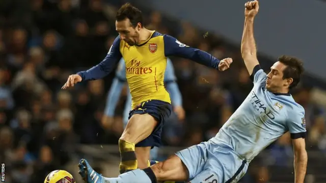 Santi Carzola is challenged by Frank Lampard