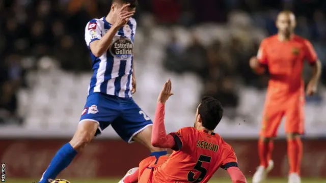 Oriol Riera and Sergio Busquets