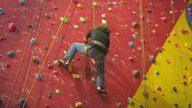 Climber on climbing wall