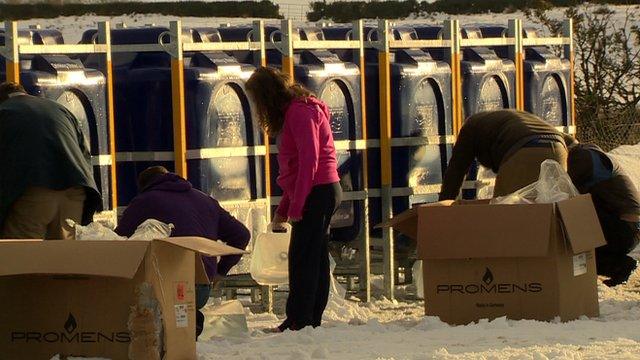 Customers who are cut off supply in County Tyrone get water from a collection point