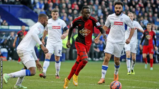 Swansea City's Mo Barrow takes on Tranmere defenders in the FA Cup third round tie