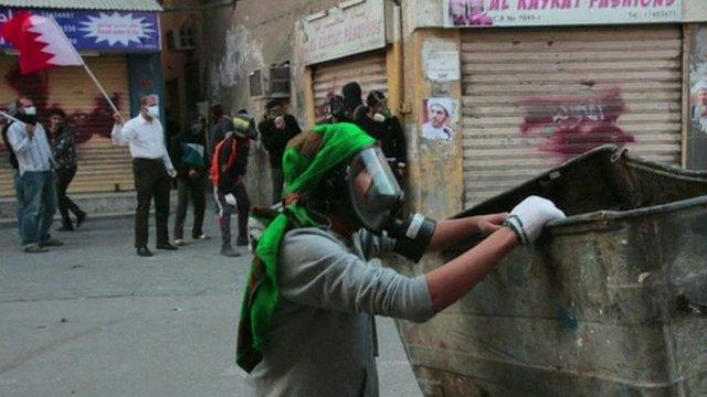 A protestor in gas mask