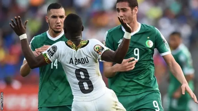 Ghana and Algeria players clash