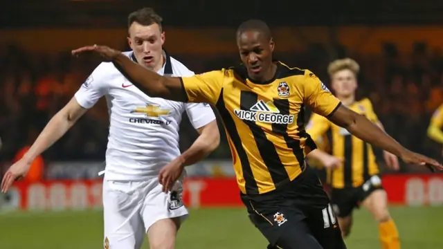 Manchester United's Phil Jones chases down Tom Elliott