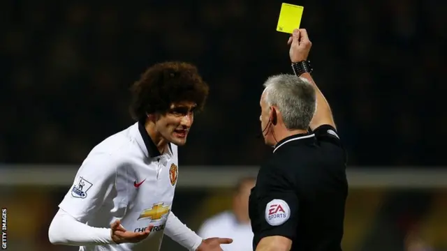 Marouane Fellaini is booked