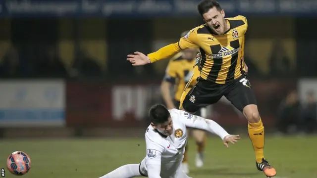 Cambridge United's Ryan Donaldson is fouled