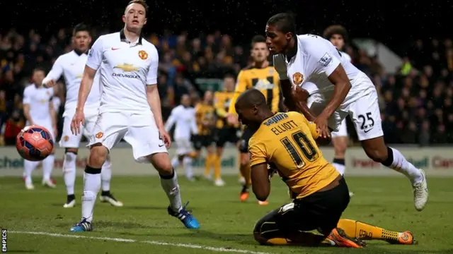 Cambridge United's Tom Elliott appeals for a penalty