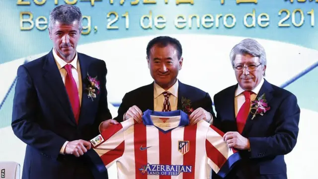 Atletico Madrid CEO Miguel Angel Gil, Wanda Group Chairman Wang Jianlin and Atletico Madrid President Enrique Cerezo