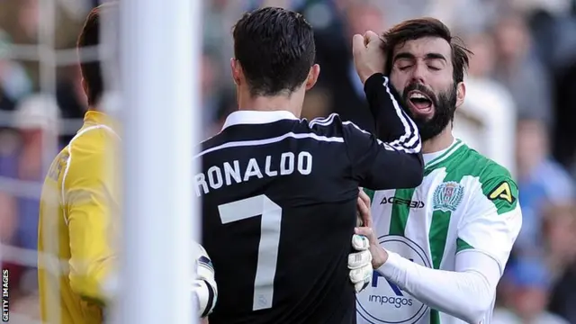 Cristiano Ronaldo strikes Cordoba"s defender Jose Angel Crespo