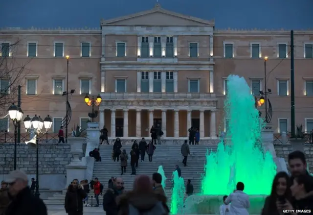 People gather at the Greek parliament in Athens, 25 January