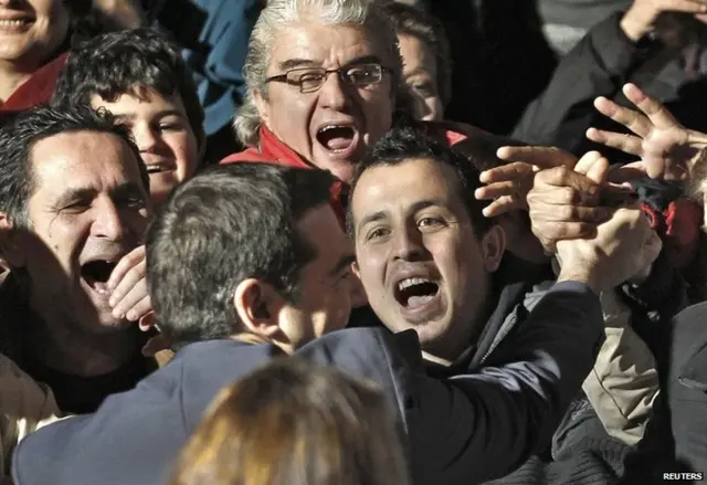 Syriza leader Alexis Tsipras is greeted by supporters in Athens, 25 January