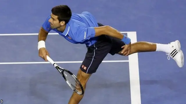 Novak Djokovic serves