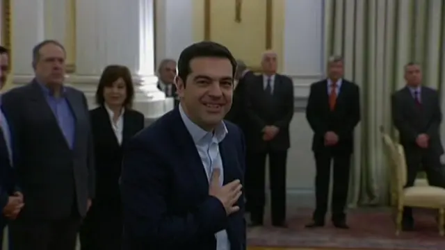 Alexis Tsipras smiles after being sworn in as prime minister of Greece, 26 January
