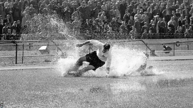 Preston's Tom Finney splashes through a puddle at Chelsea in 1956