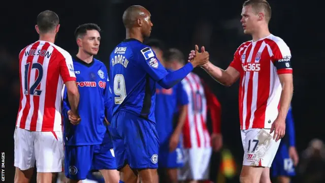 Rochdale and Stoke shake hands