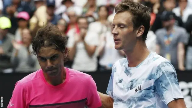 Rafael Nadal is consoled by Tomas Berdych