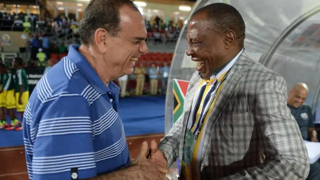 Managers shake hands
