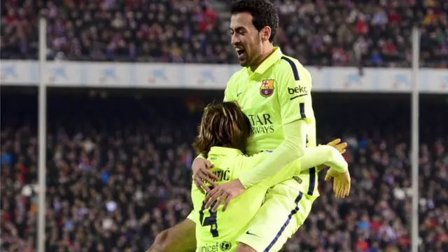 Sergio Busquets and Ivan Rakitic celebrate