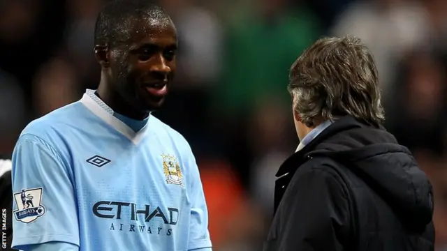 Yaya Toure and Roberto Mancini