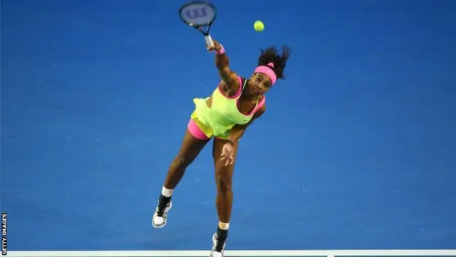 Serena Williams serves