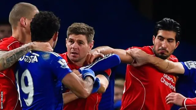 Diego Costa of Chelsea clashes with Steven Gerrard (centre) and Emre Can (right) of Liverpool