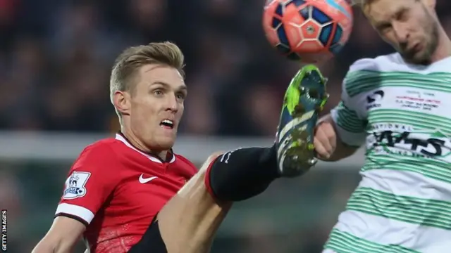 Manchester United's Darren Fletcher in action with Simon Gillett of Yeovil Town during the FA Cup Third Round