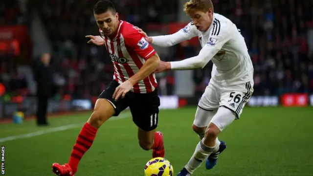 Tadic and Fulton battle for the ball