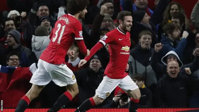 Juan Mata celebrates scoring