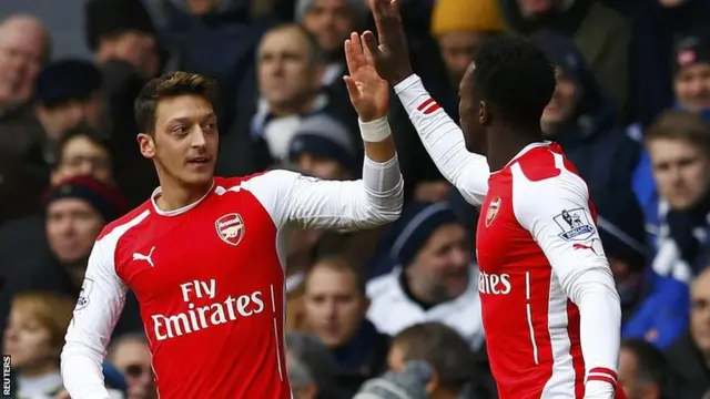 Mesut Ozil and Danny Welbeck celebrate