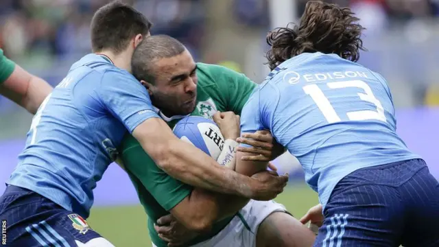 Simon Zebo is wrapped up by the Italy defence