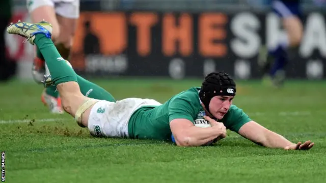 Tommy O'Donnell dives over to score for Ireland