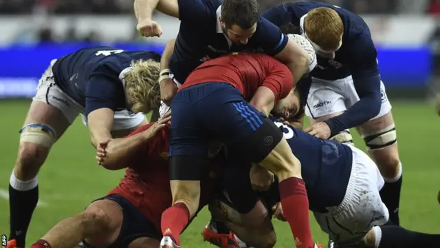 France and Scotland fight for the ball