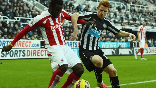 Stoke's Mame Diouf and Newcastle's Jack Colback