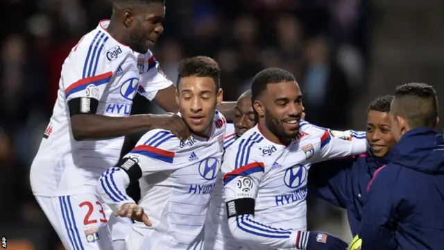 Lyon celebrate a goal by Alexandre Lacazette