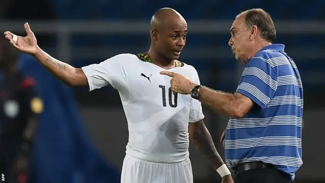 Ghana coach Avram Grant speaks to Andre Ayew