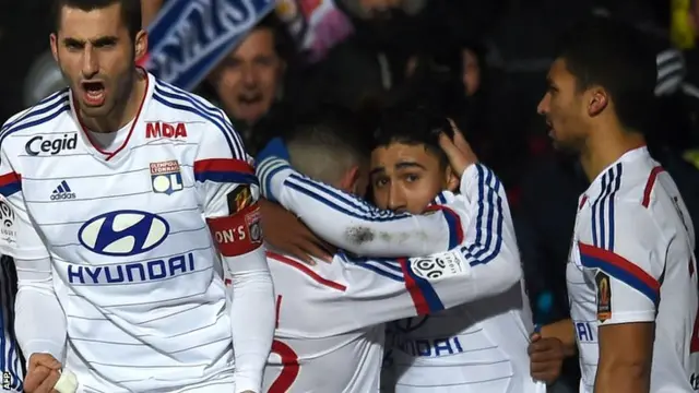 Lyon celebrate going 1-0 up against PSG