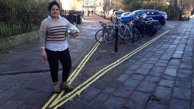 Kika Hedgecock standing next to the bicycle parking bay with double yellow lines around it