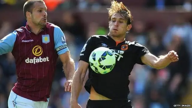 Ron Vlaar and Nikica Jelavic tussle for the ball